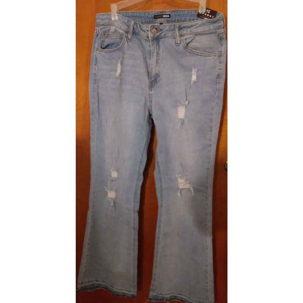 Women's -ripped stretched flare leg  light blue wash size 15  15w x 43L  x 32iS